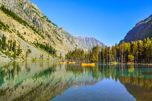 Stunning view of Mahodand Lake in Kalam, surrounded by mountains and vibrant forests.