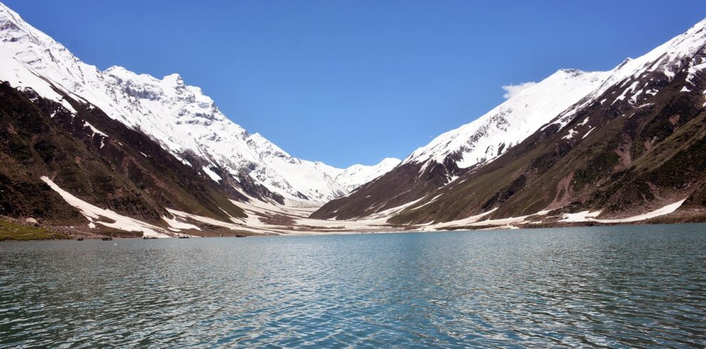 Naran Kaghan tour — Lake Saiful Muluk with snow-capped peaks reflected in glacial water, Kaghan Valley