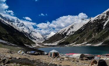 4 days Naran Shogran tour package showing turquoise Lake Saiful Muluk with Malika Parbat reflection
