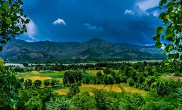 Scenic view of Kalam Valley in Pakistan with lush greenery and mountains.